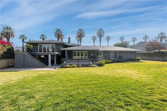 a view of a swimming pool with an outdoor seating