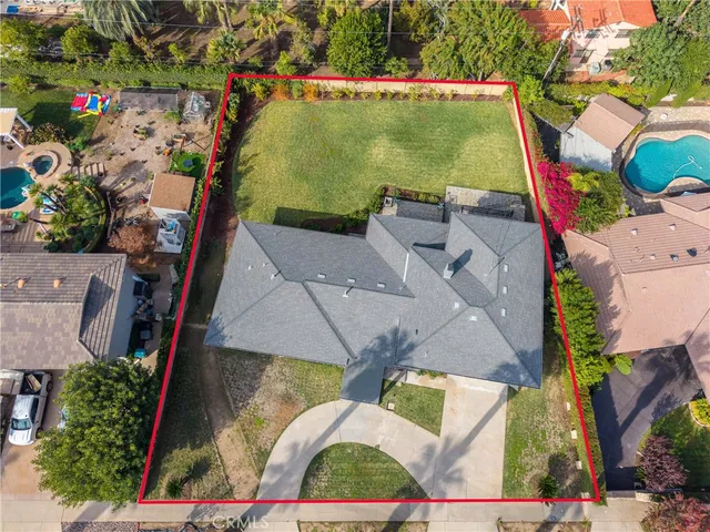 an aerial view of a house with outdoor space