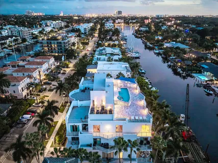 an aerial view of residential building and lake