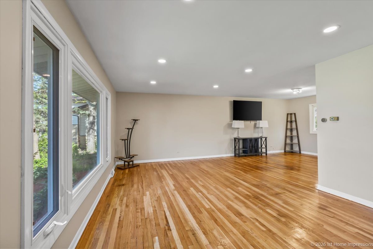 18847 May Avenue Homewood, IL 60430 - Photo 7 of 26 a view of empty room with wooden floor and fireplace
