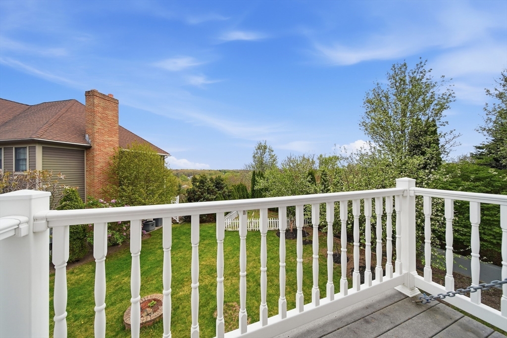 131 Range Heights Road Lynn, MA 01904 - Photo 18 of 36 a balcony with wooden floor and fence