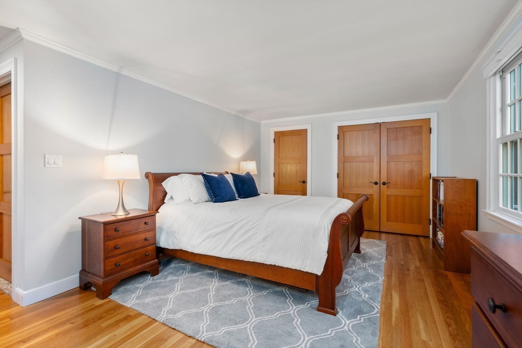 156 Cherry Brook Road Weston, MA 02493 - Photo 22 of 38 a bedroom with a bed and wooden floor