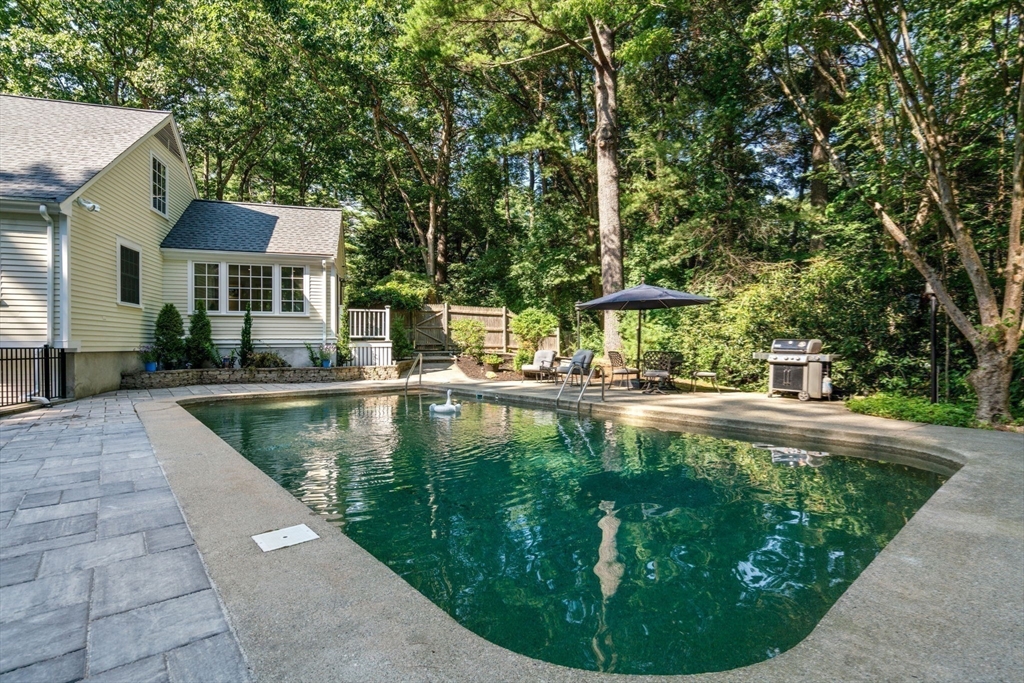 156 Cherry Brook Road Weston, MA 02493 - Photo 35 of 38 a view of a swimming pool with a patio