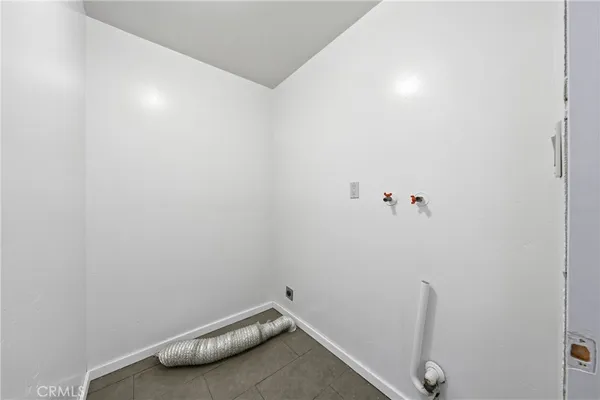 a view of room with racks on the wall