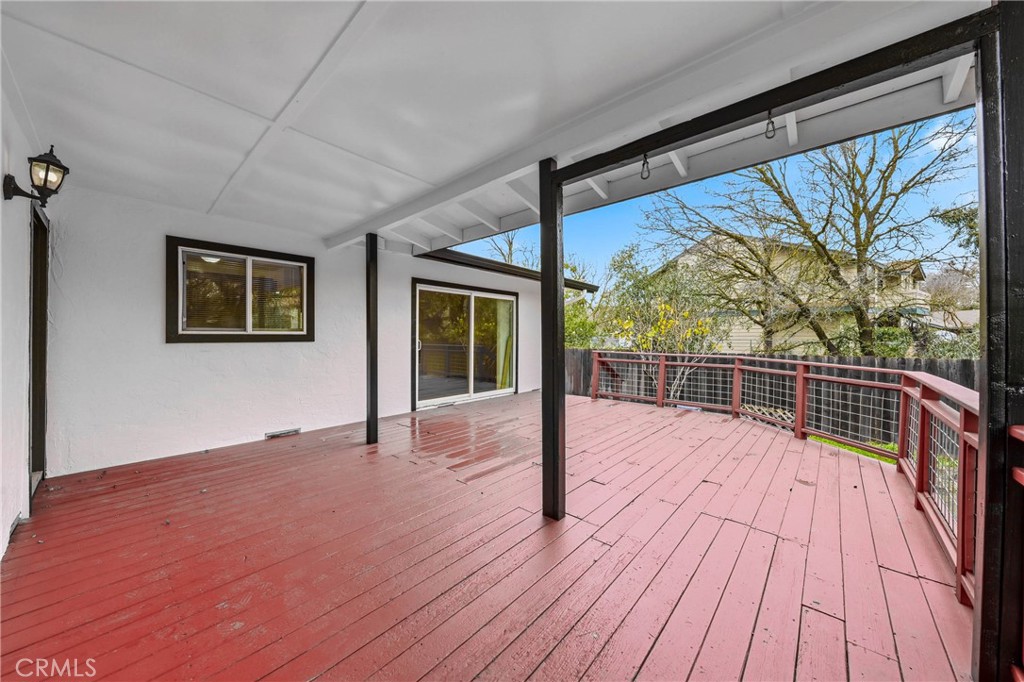 6150 Ridgeview Drive Clearlake, CA 95422 - Photo 35 of 38 a view of an empty room with wooden floor and a window