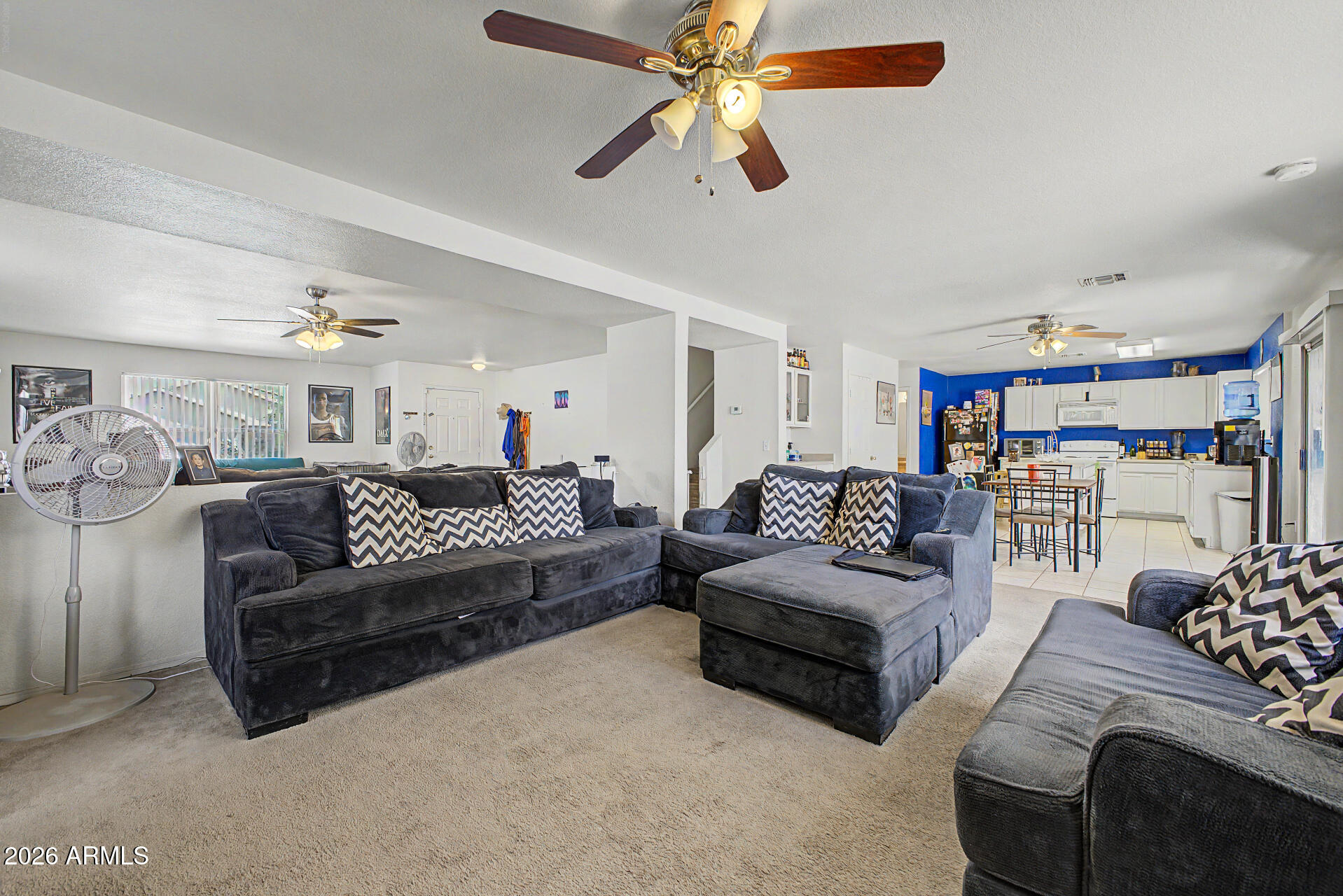 2607 West Bloch Road Phoenix, AZ 85041 - Photo 9 of 34 a living room with furniture and a ceiling fan
