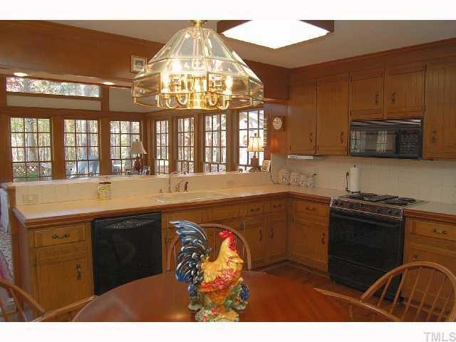 8713 Hidden View Court Raleigh, NC 27613 - Photo 7 of 12 a kitchen with a stove and a sink