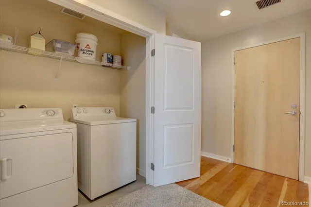 a view of storage and utility room with a washer and dryer