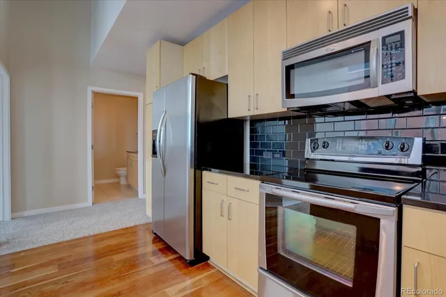 a kitchen with a stove and a microwave