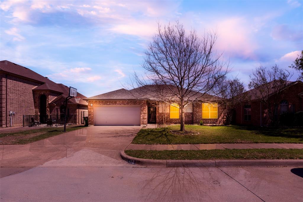 192 Hirth Drive Crowley, TX 76036 - Photo 1 of 22 a front view of a house with a yard and garage