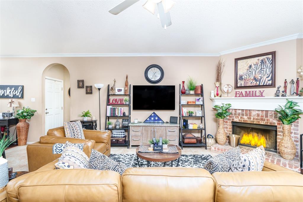 192 Hirth Drive Crowley, TX 76036 - Photo 12 of 22 a living room with fireplace furniture and a flat screen tv