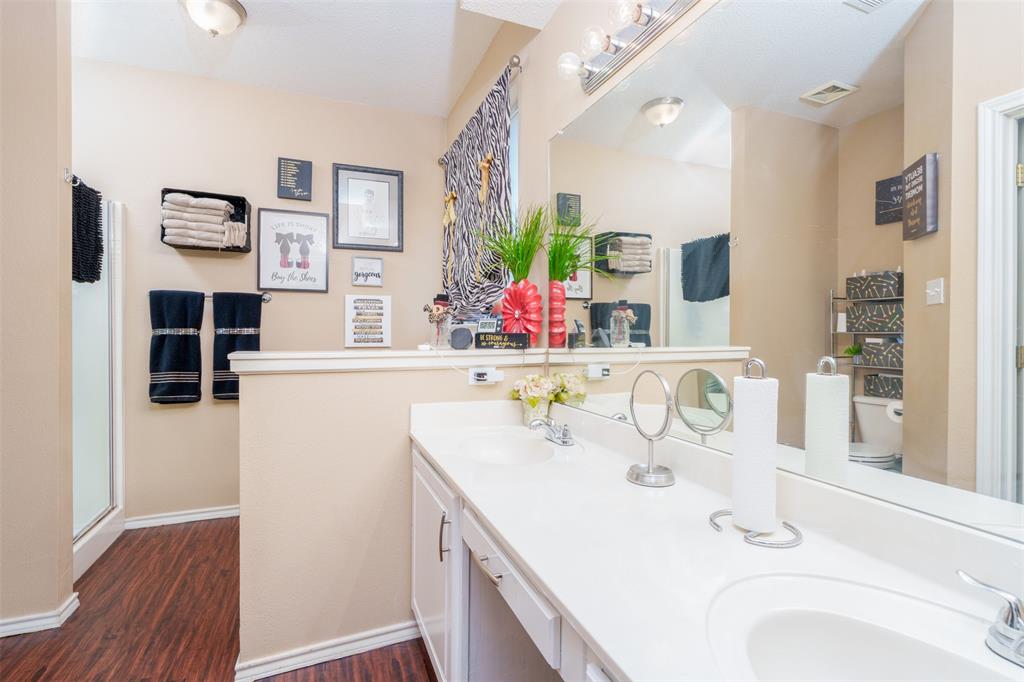 192 Hirth Drive Crowley, TX 76036 - Photo 15 of 22 a bathroom with a sink and a mirror