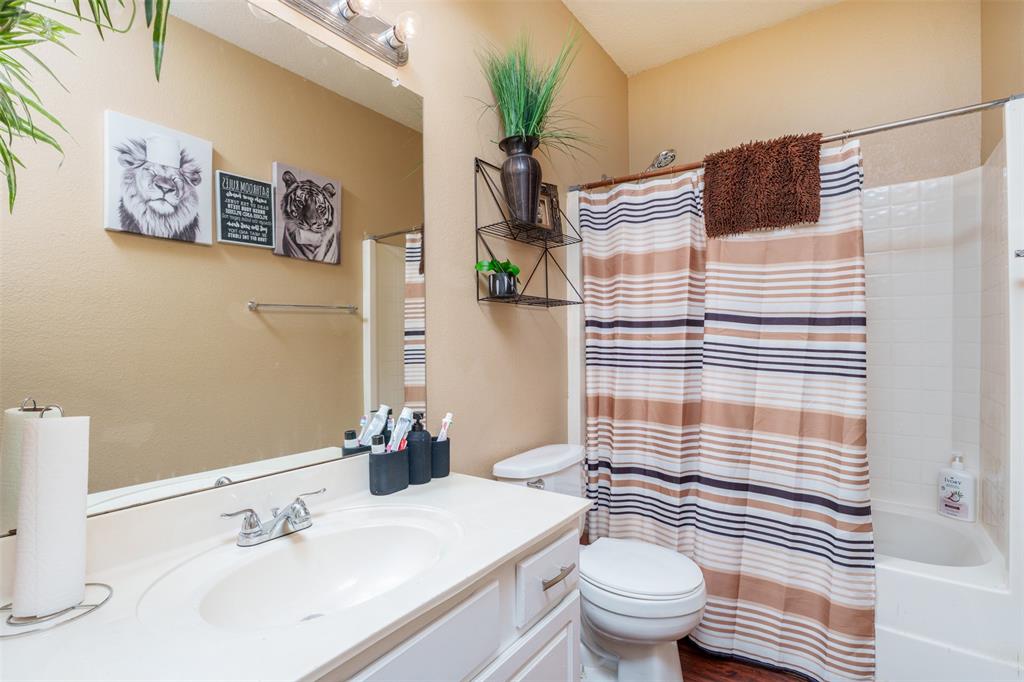 192 Hirth Drive Crowley, TX 76036 - Photo 18 of 22 a bathroom with a sink toilet and shower