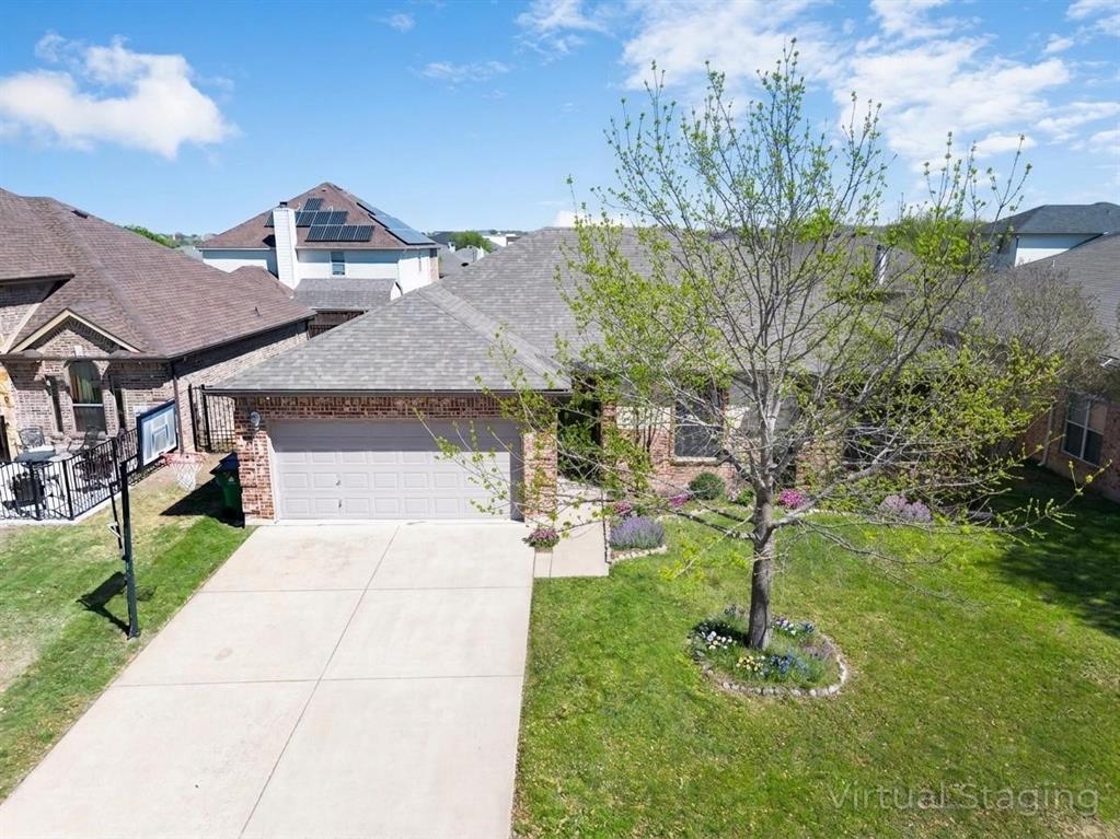 192 Hirth Drive Crowley, TX 76036 - Photo 2 of 22 a front view of a house with garden