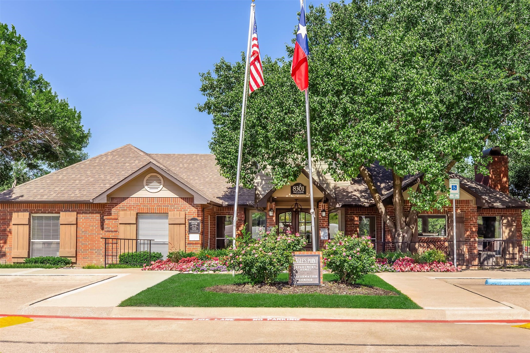 8301 Boat Club Road, Unit 827 Fort Worth, TX 76179 - Photo 18 of 42 a front view of a house with a yard and potted plants