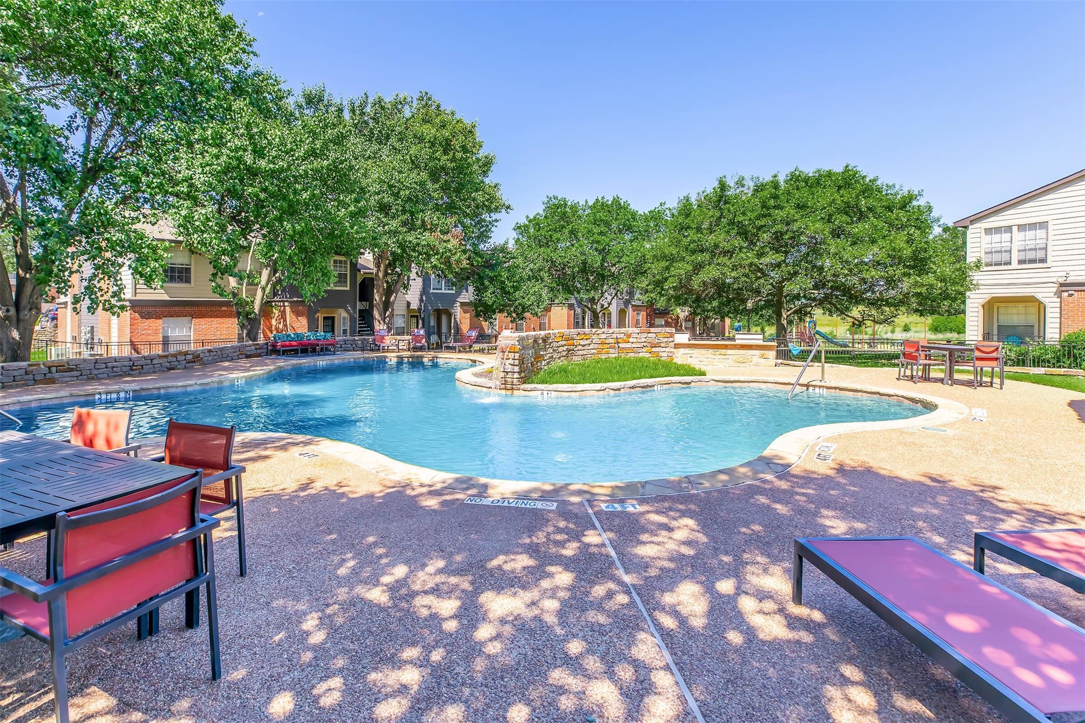 8301 Boat Club Road, Unit 827 Fort Worth, TX 76179 - Photo 19 of 42 a view of swimming pool with lawn chairs and plants