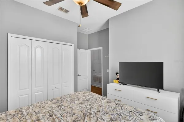 a bathroom with a sink double vanity granite tub and a mirror