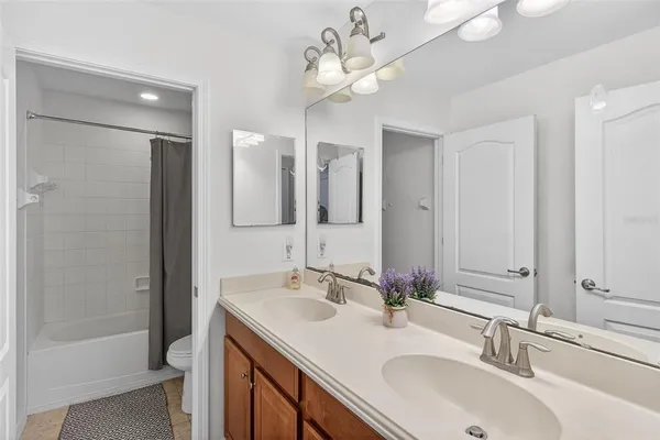 a bathroom with a shower and a sink