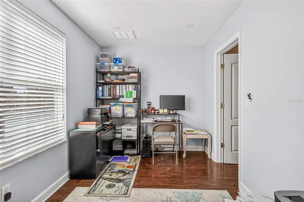 a view of a chairs and table in patio