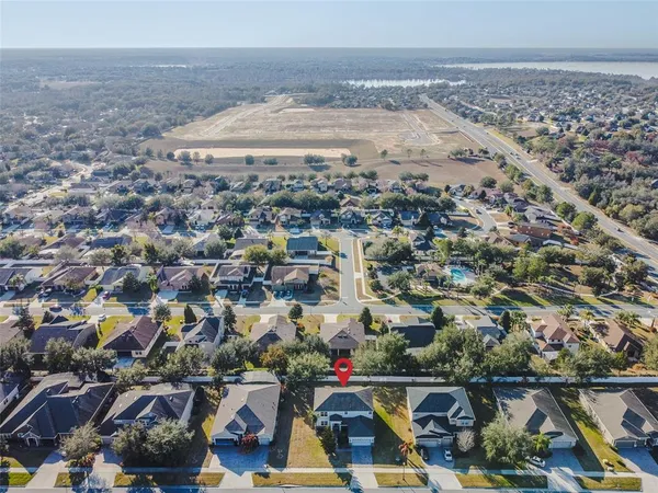 a view of a dining room with furniture wooden floor and chandelier