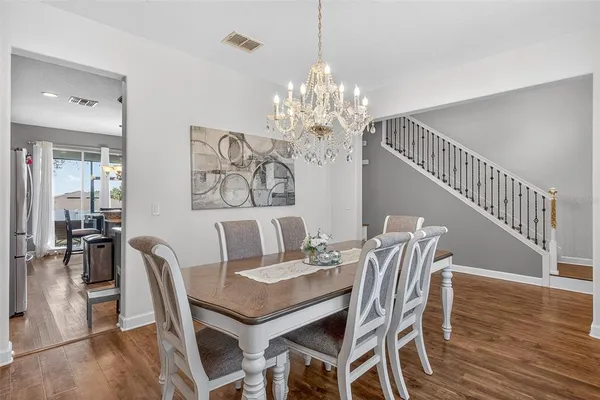 a kitchen with stainless steel appliances granite countertop a sink and a stove