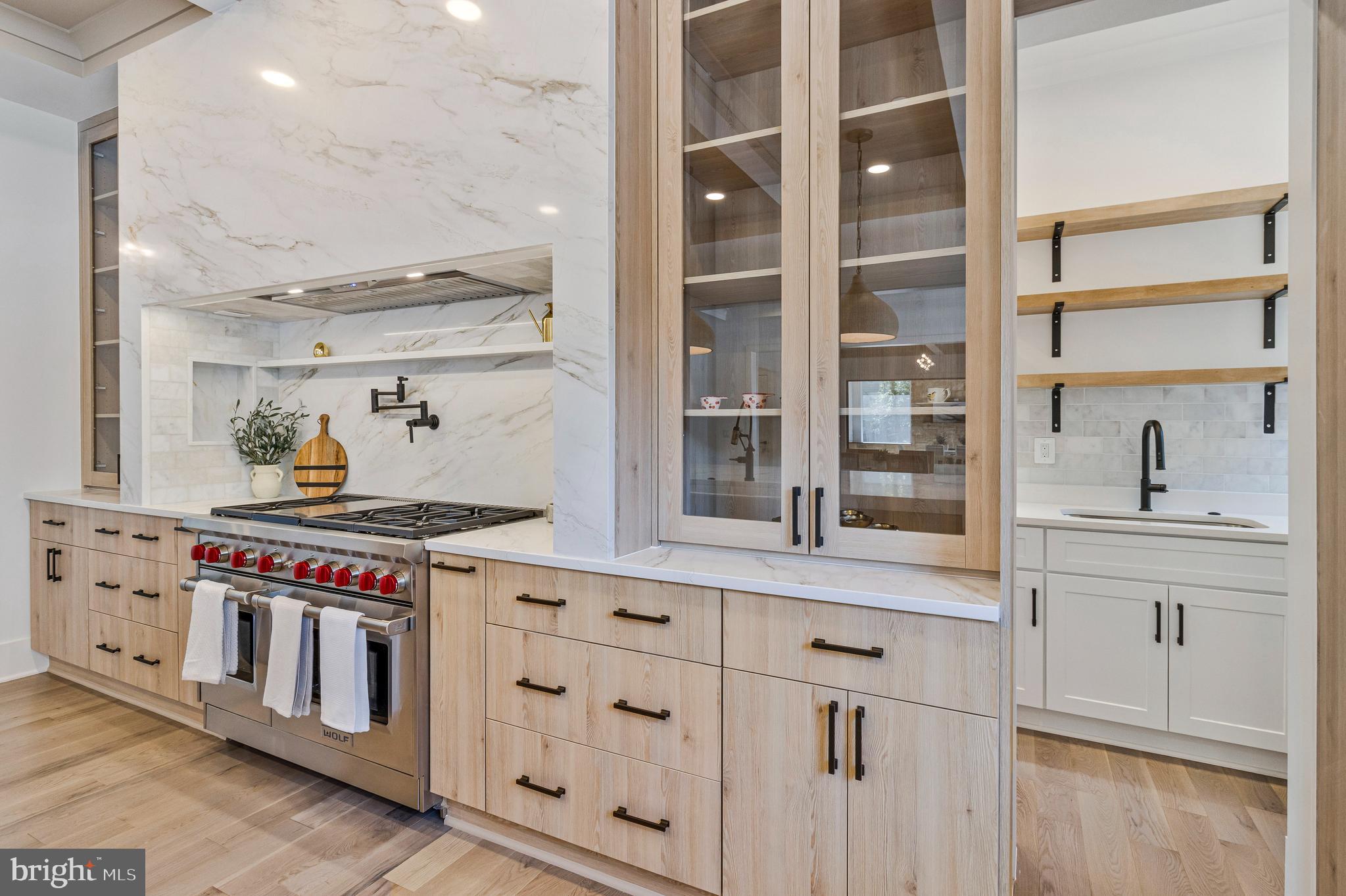 7709 Sebago Road Bethesda, MD 20817 - Photo 13 of 65 a kitchen with stainless steel appliances granite countertop a stove and a cabinets