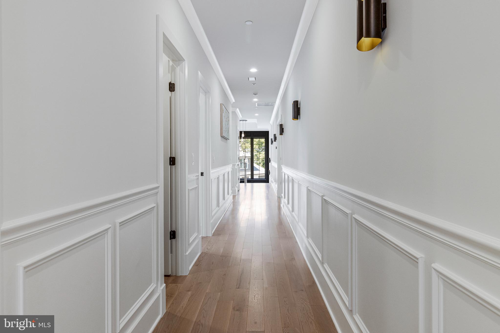 7709 Sebago Road Bethesda, MD 20817 - Photo 21 of 40 a view of a hallway with wooden floor
