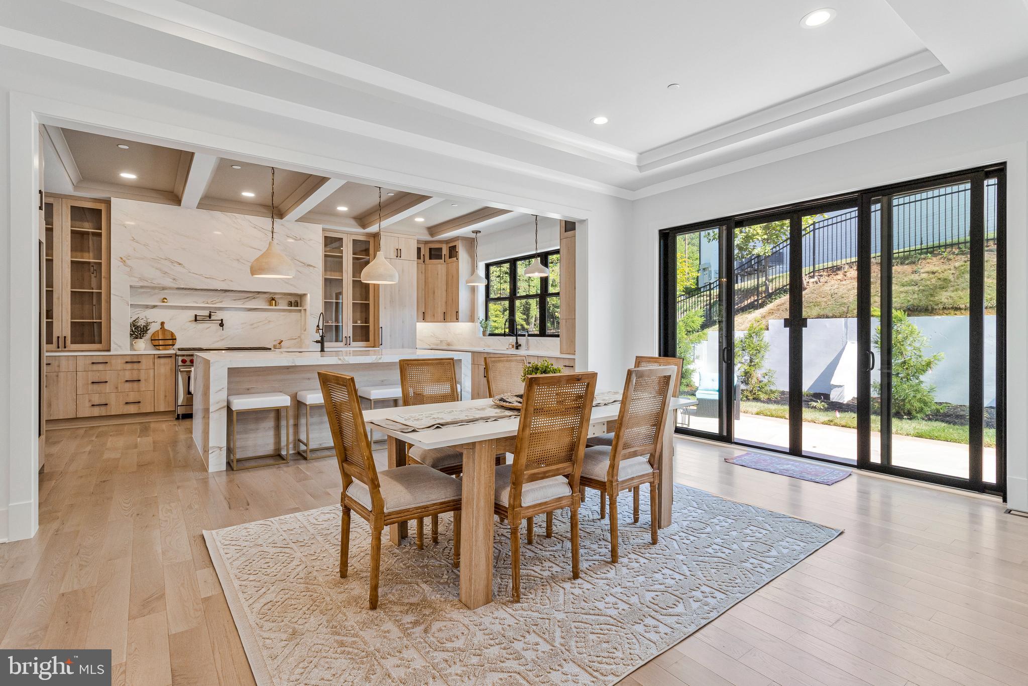 7709 Sebago Road Bethesda, MD 20817 - Photo 29 of 68 a view of a dining room with furniture and wooden floor