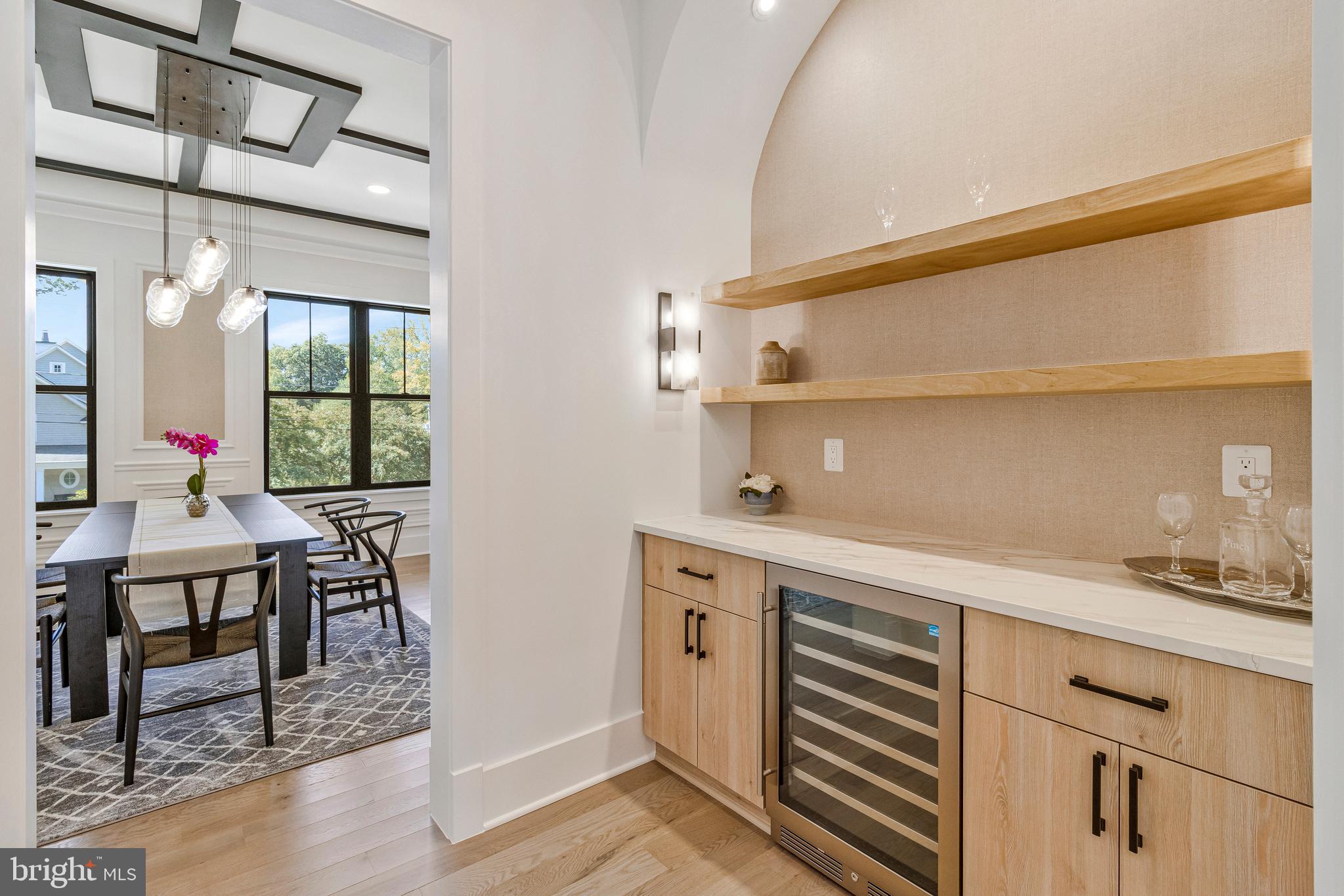 7709 Sebago Road Bethesda, MD 20817 - Photo 33 of 68 a kitchen with a sink cabinets and wooden floor