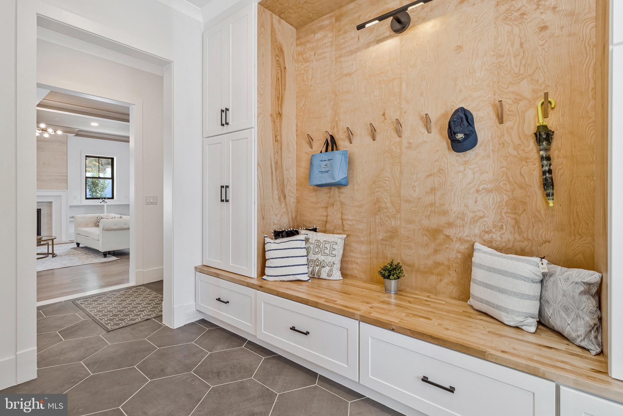 7709 Sebago Road Bethesda, MD 20817 - Photo 35 of 68 a spacious bathroom with a granite countertop sink a mirror and shower