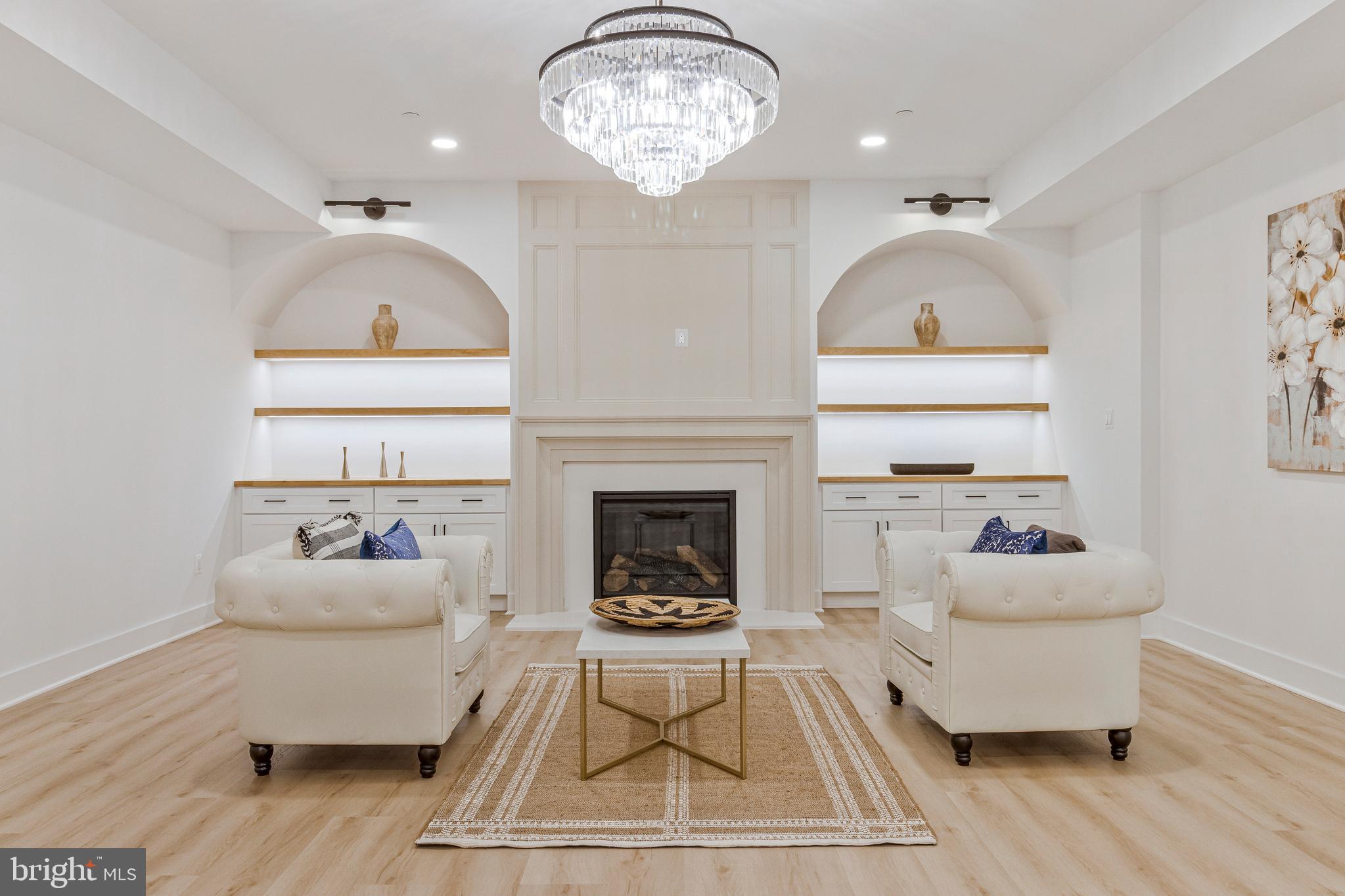 7709 Sebago Road Bethesda, MD 20817 - Photo 35 of 40 a living room with furniture and a fireplace