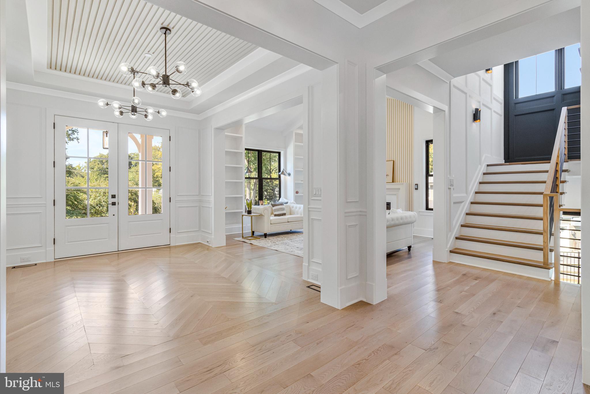 7709 Sebago Road Bethesda, MD 20817 - Photo 4 of 65 wooden floor in an empty room with a window