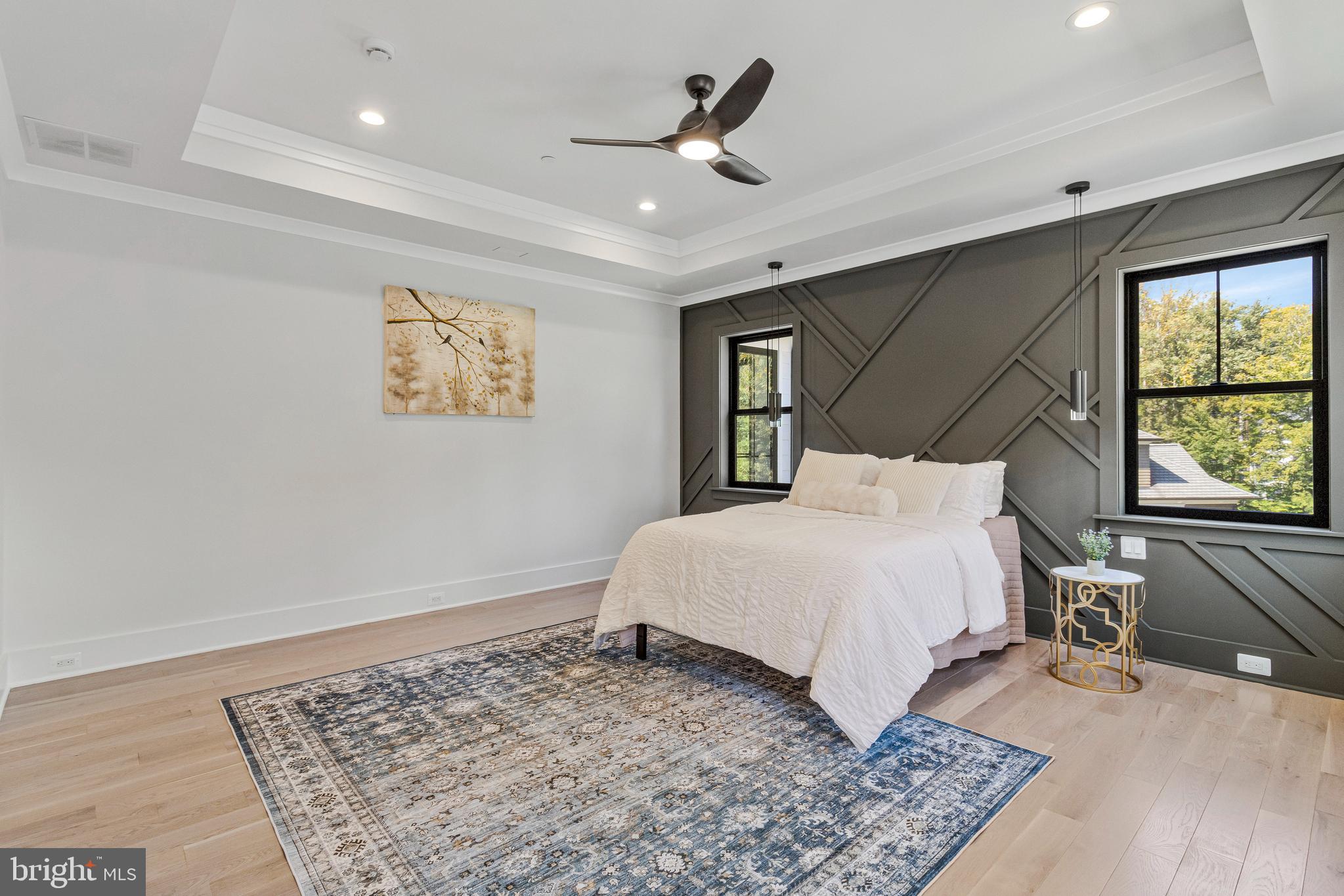 7709 Sebago Road Bethesda, MD 20817 - Photo 41 of 65 a bedroom with a large bed and a large window