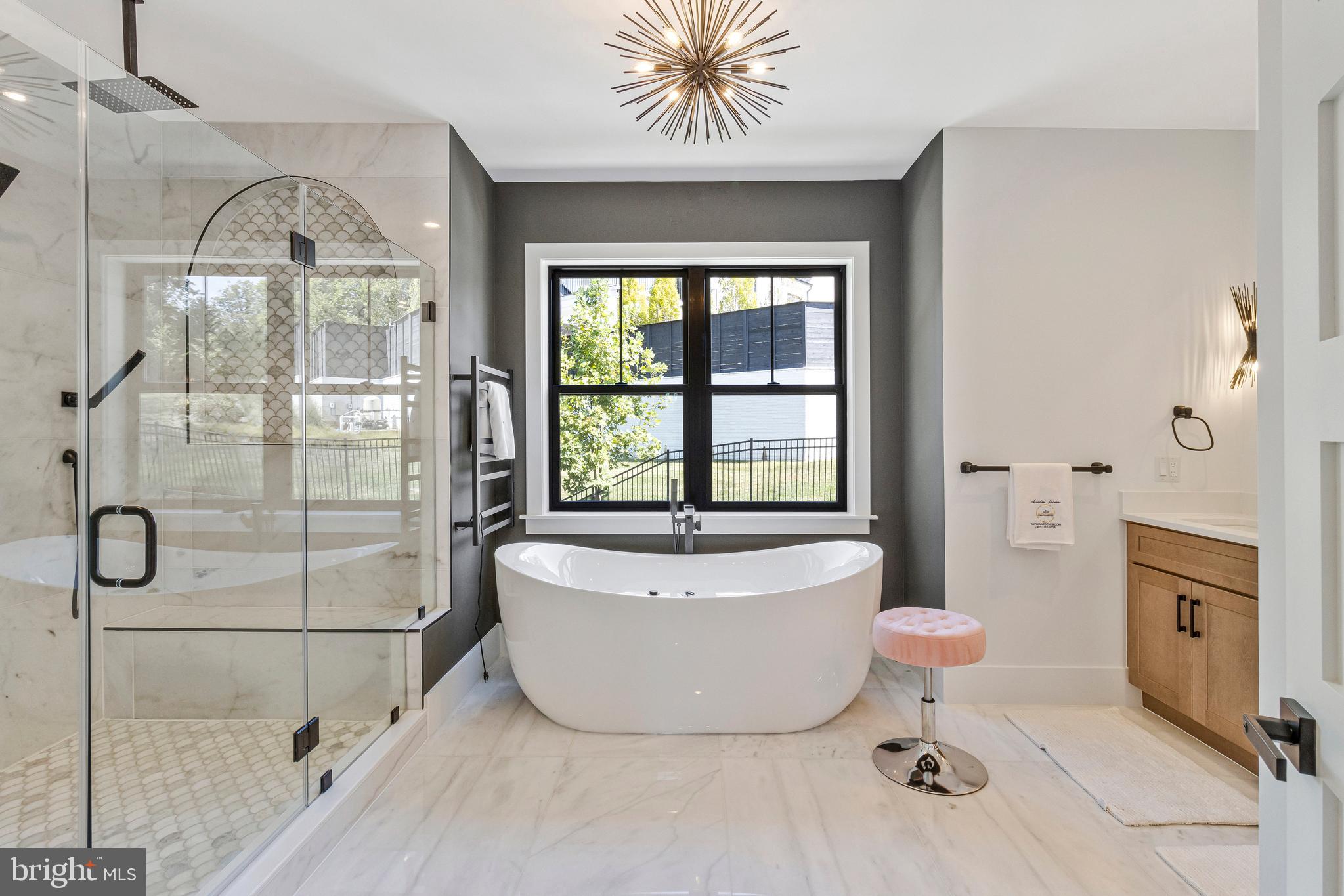 7709 Sebago Road Bethesda, MD 20817 - Photo 48 of 68 a spacious bathroom with a bathtub and shower