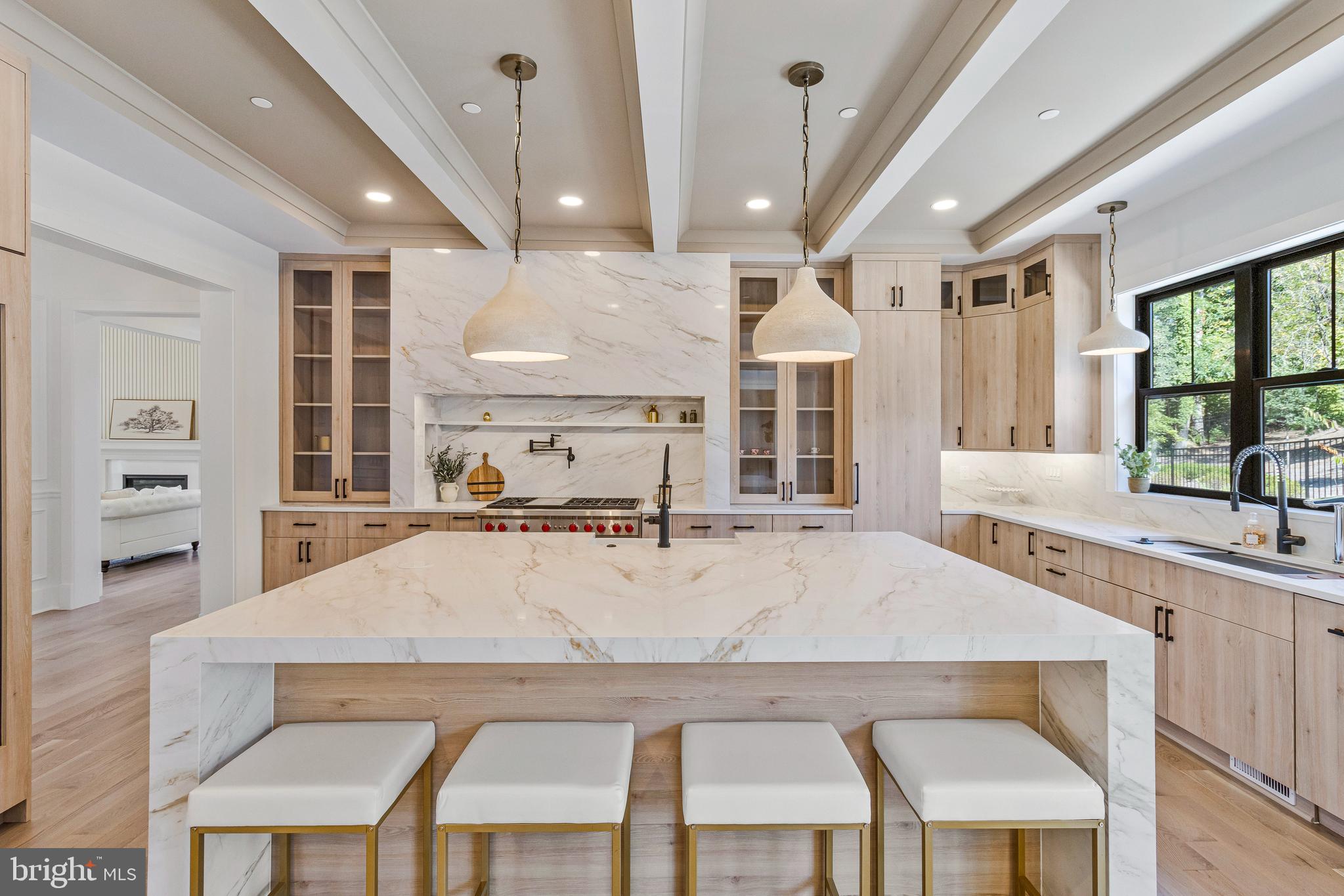 7709 Sebago Road Bethesda, MD 20817 - Photo 5 of 40 a large kitchen with a table and chairs