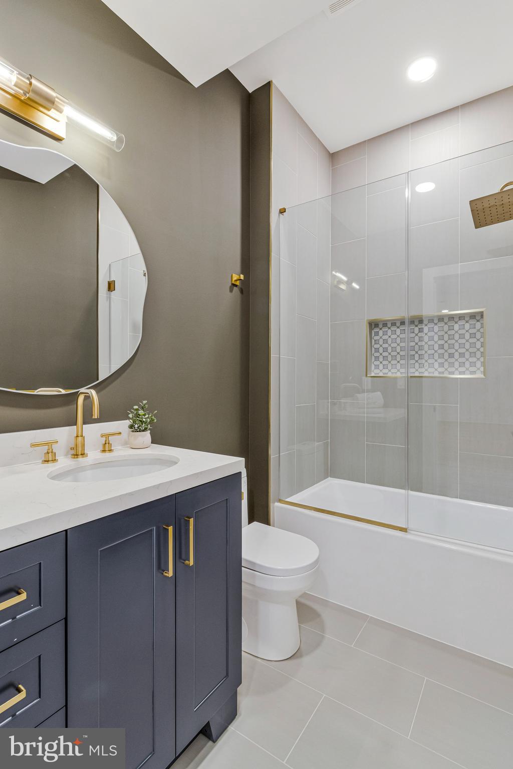 7709 Sebago Road Bethesda, MD 20817 - Photo 55 of 65 a bathroom with a sink a toilet and shower