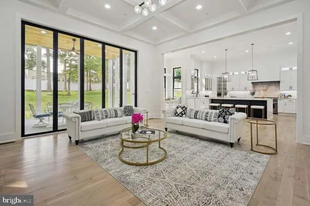 a large kitchen with a table and chairs