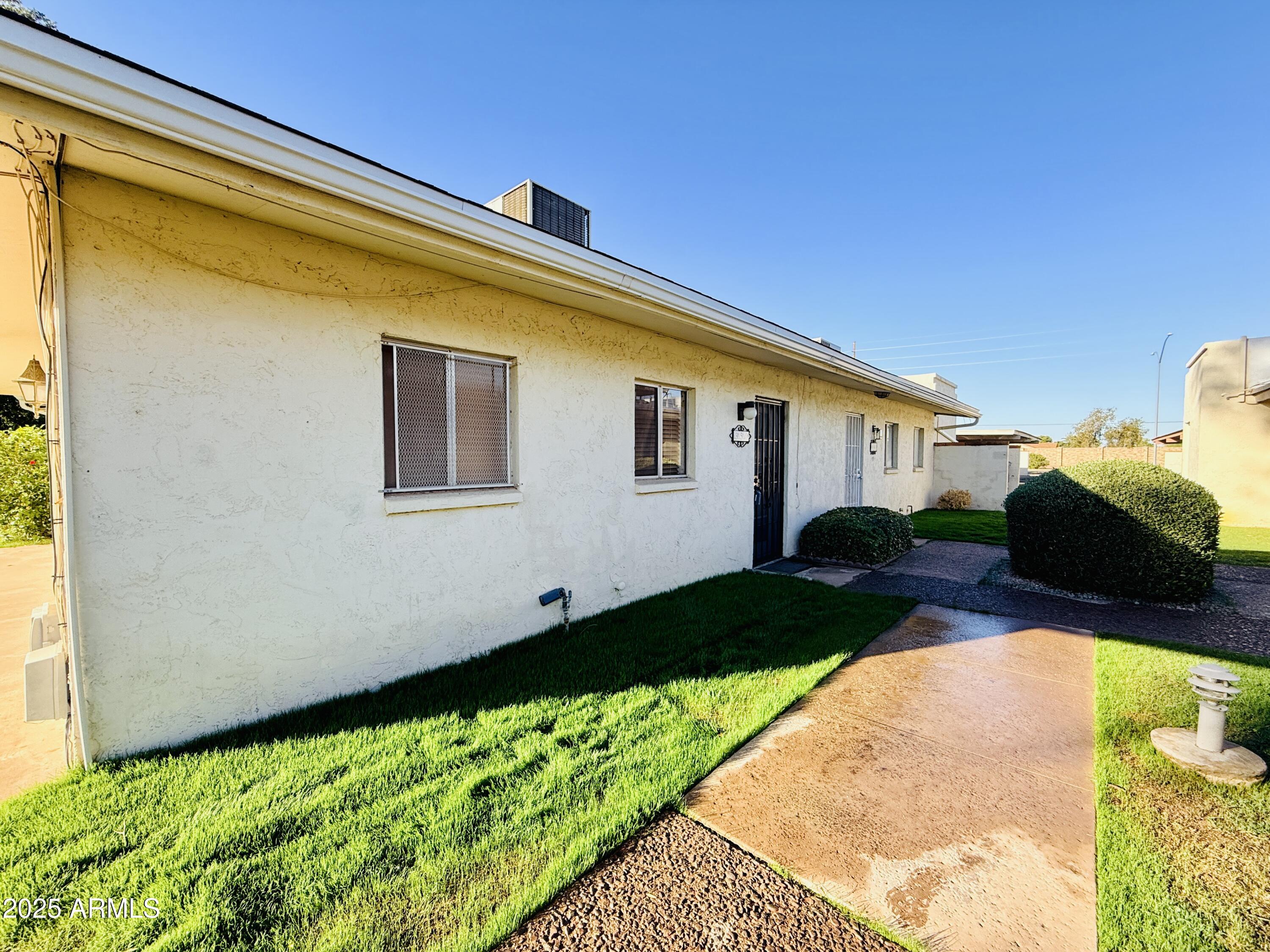625 South Power Road, Unit 350 Mesa, AZ 85206 - Photo 16 of 20 a front view of house with yard