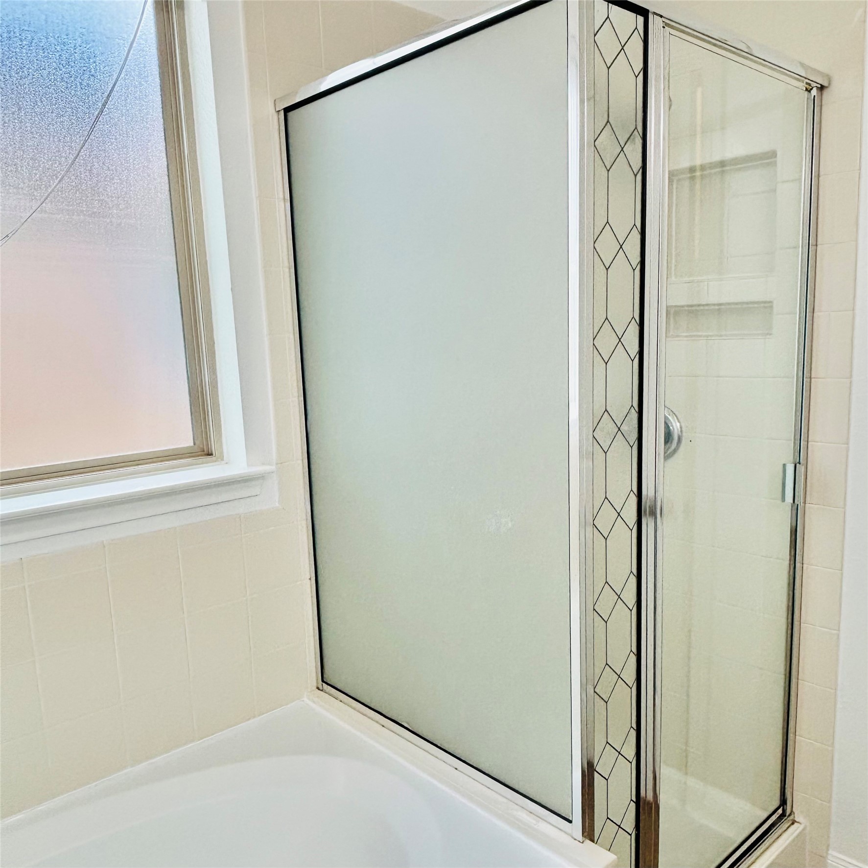22480 Toronado Ridge Lane Porter, TX 77365 - Photo 32 of 42 a bathroom with a glass shower door