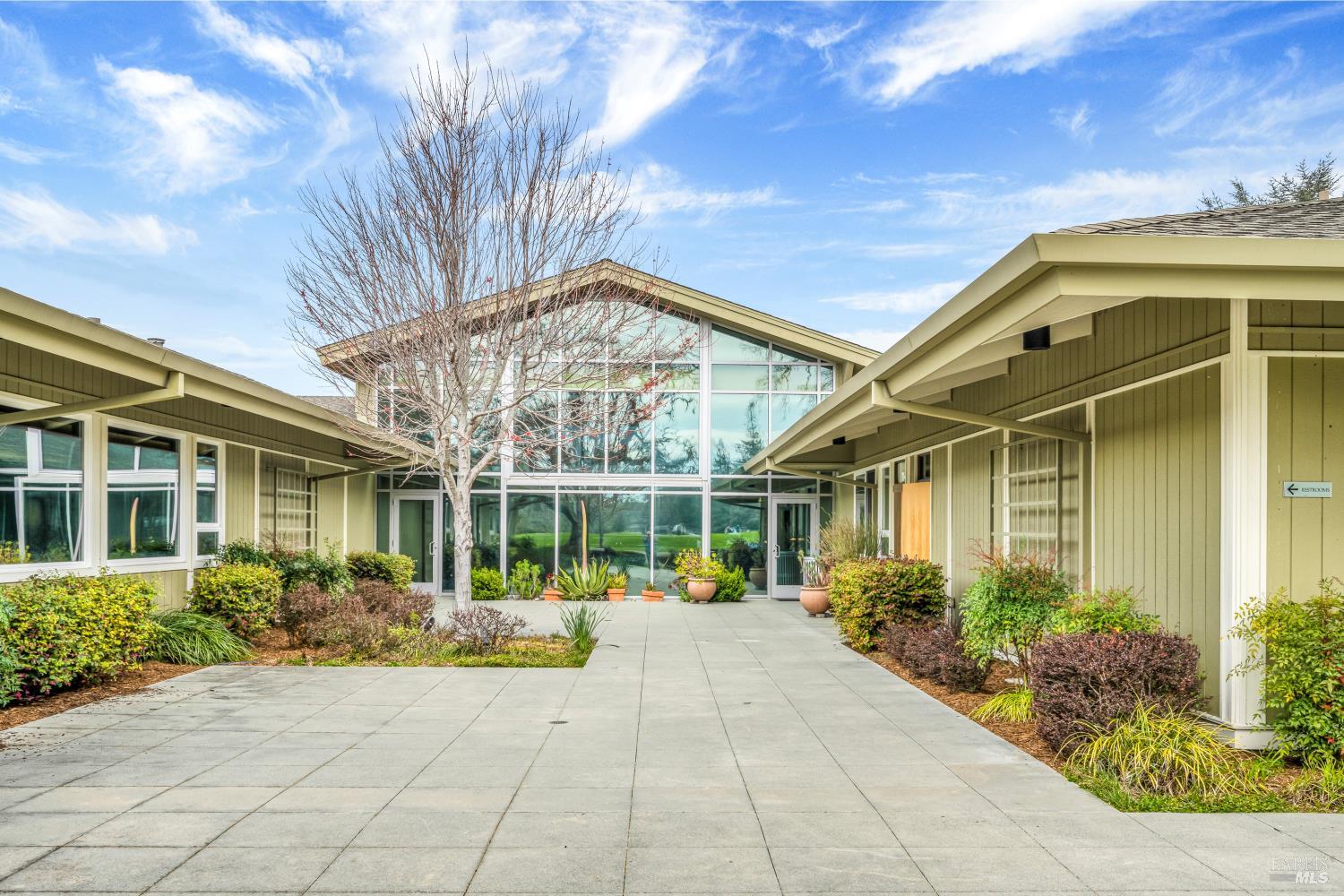 23 Valley Green Street Santa Rosa, CA 95409 - Photo 44 of 58 a view of a house with large windows and plants