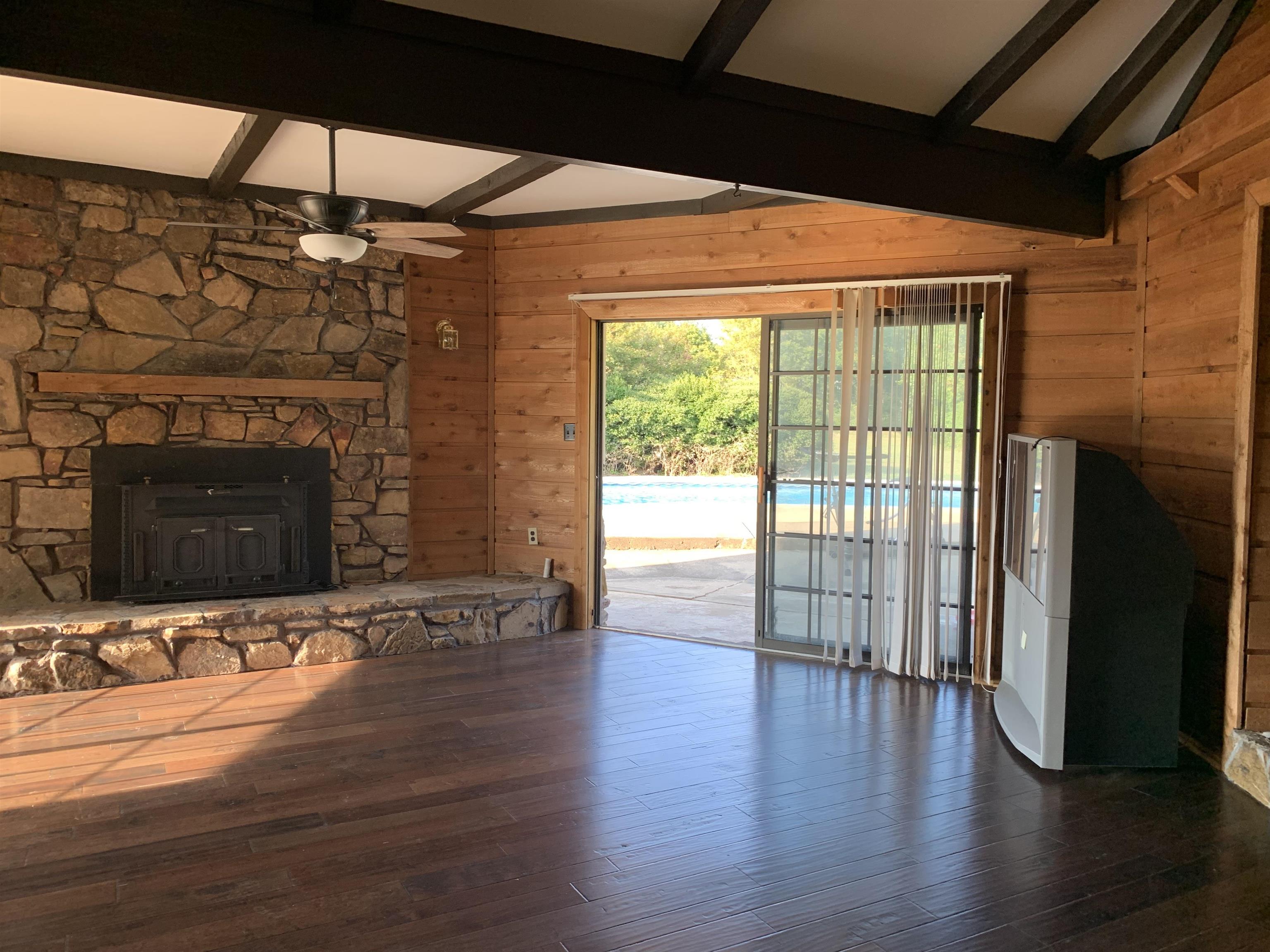 11280 Pleasant Ridge Road Arlington, TN 38002 - Photo 20 of 34 a view of an empty room with wooden floor and a fireplace