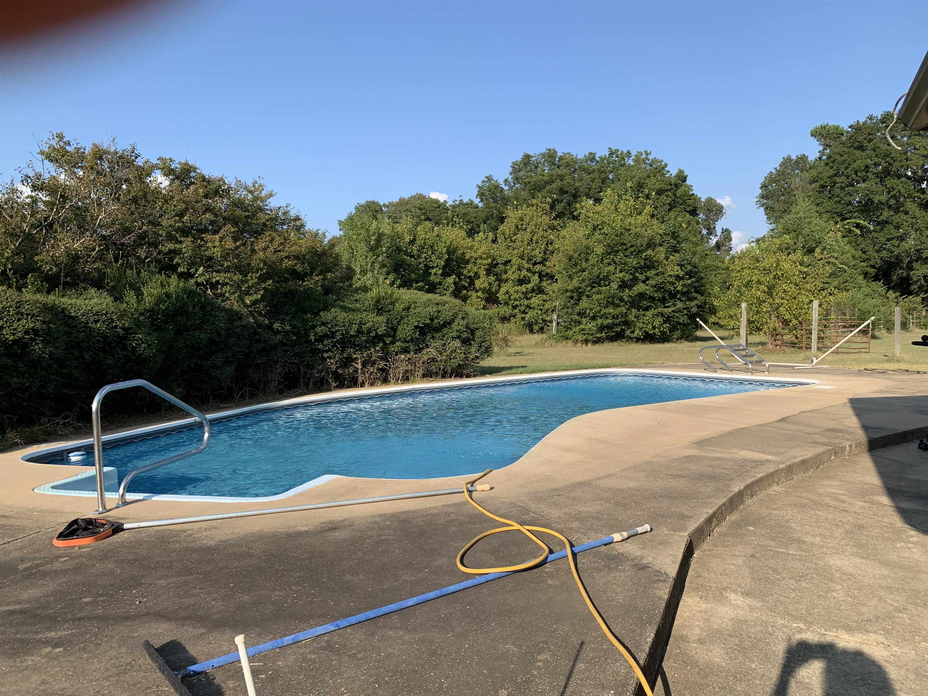 11280 Pleasant Ridge Road Arlington, TN 38002 - Photo 21 of 34 a view of a swimming pool with a yard