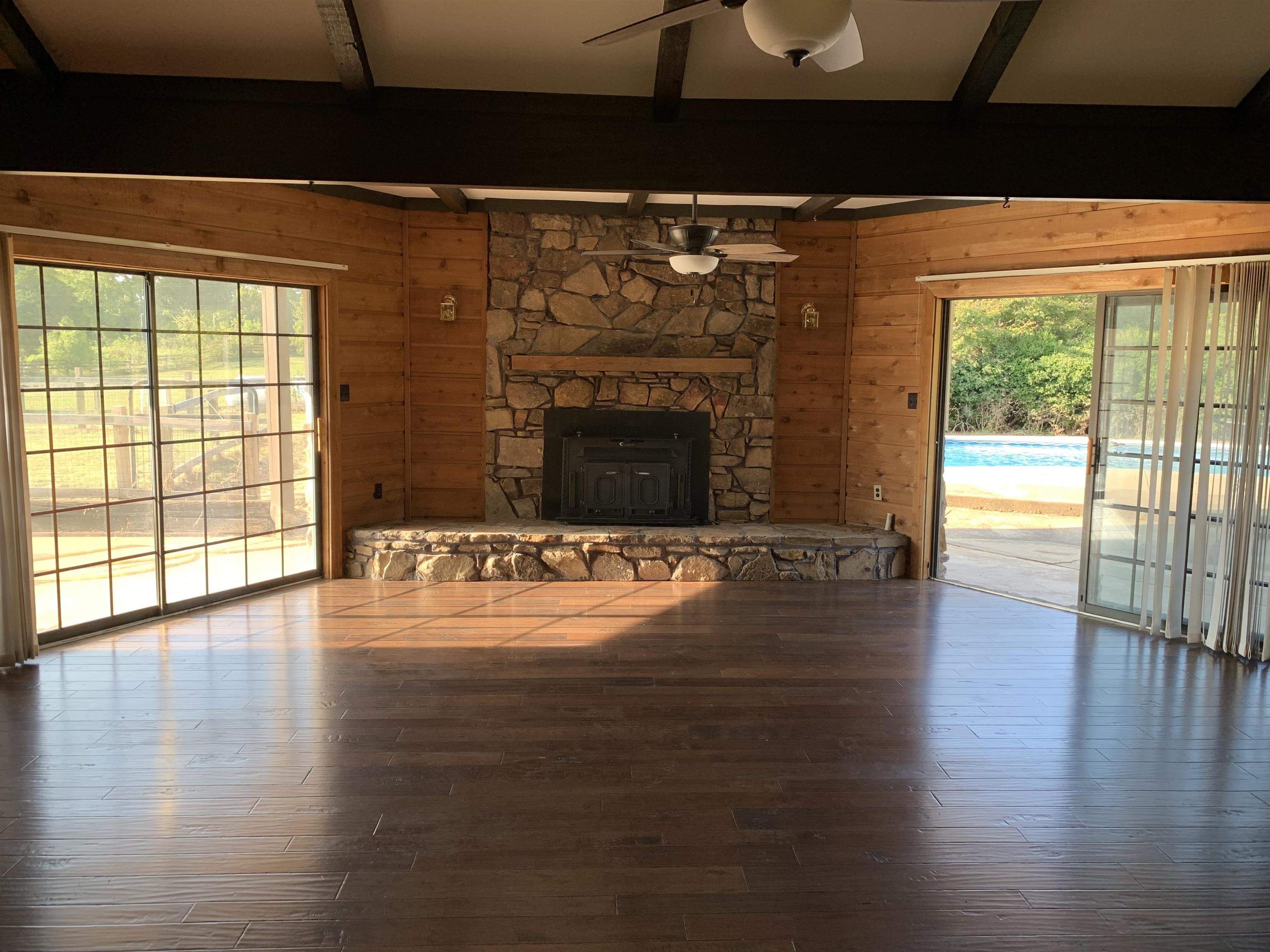 11280 Pleasant Ridge Road Arlington, TN 38002 - Photo 5 of 34 a view of empty room with wooden floor and fireplace