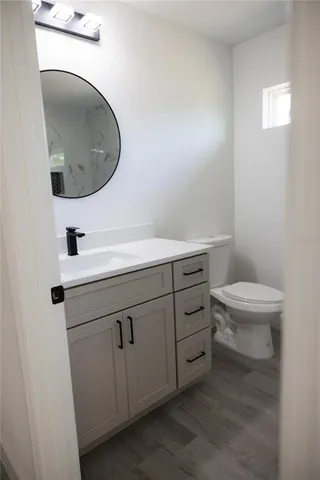 a view of hallway with stairs and wooden floor