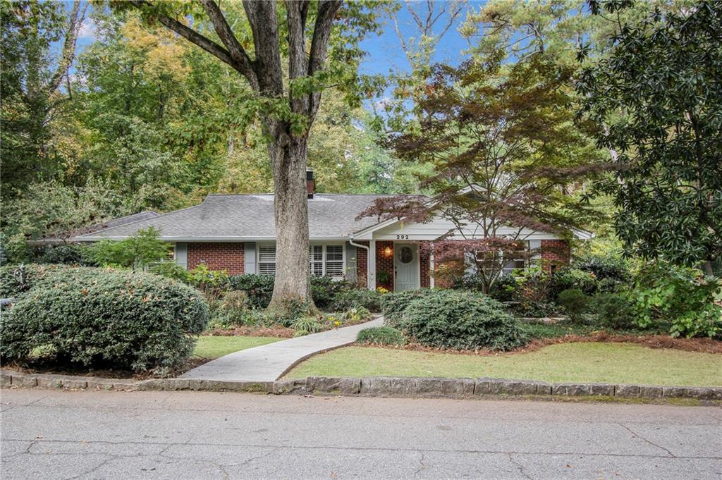 292 Chelsea Circle Decatur, GA 30030 - Photo 1 of 1 a front view of a house with a yard and trees
