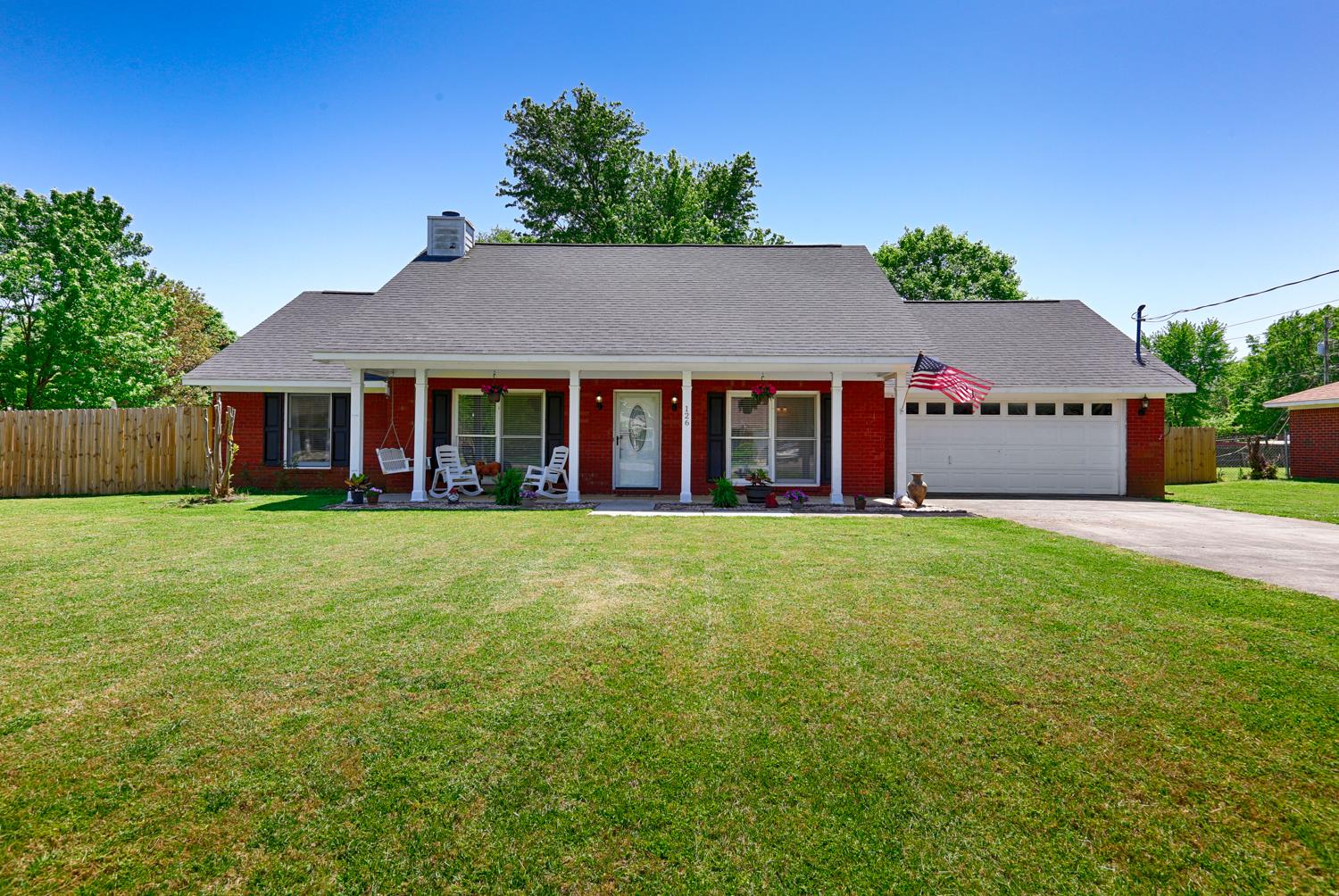 126 Raspberry Way Madison, AL 35757 - Photo 1 of 25 Front View of Home - Updated brick rancher with spacious covered front porch, concrete drive, 2-car attached garage, back patio and new 6' plank privacy fence in back yard.