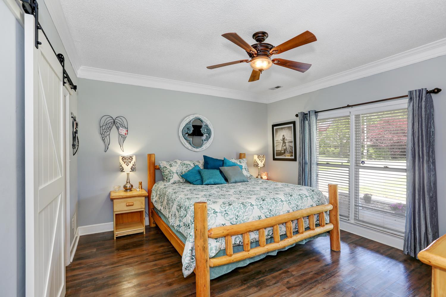 126 Raspberry Way Madison, AL 35757 - Photo 13 of 25 Master Bedroom - With laminate flooring, walk-in closet and private bath with sliding barn-like door.