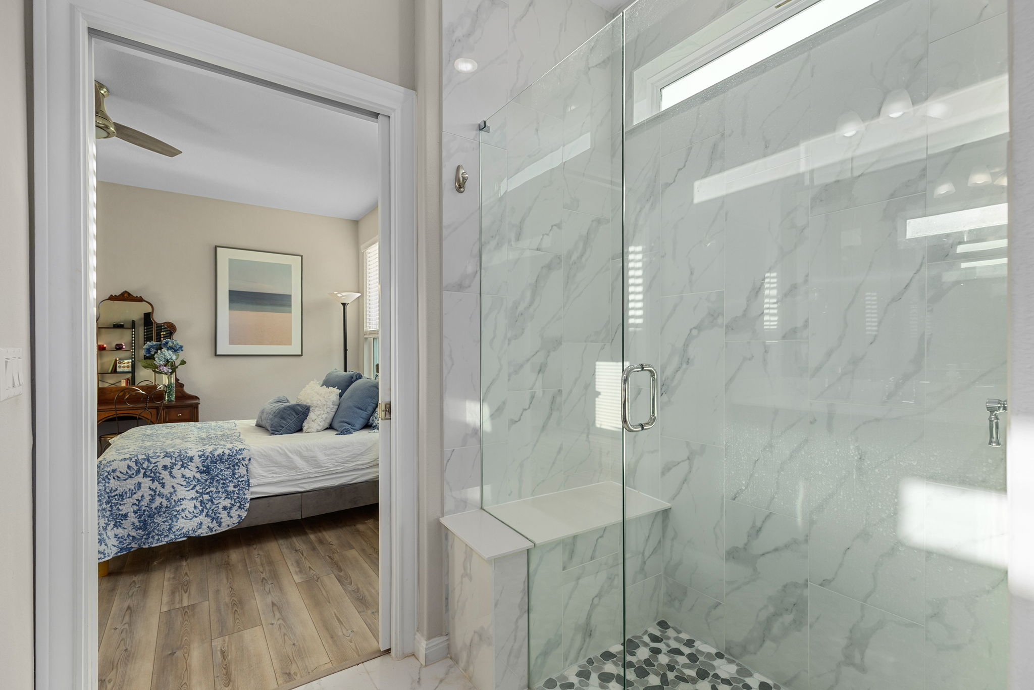 101 Bristol Cove Georgetown, TX 78633 - Photo 23 of 29 Ensuite bathroom featuring a marble finish shower, light wood-style floors, and ceiling fan