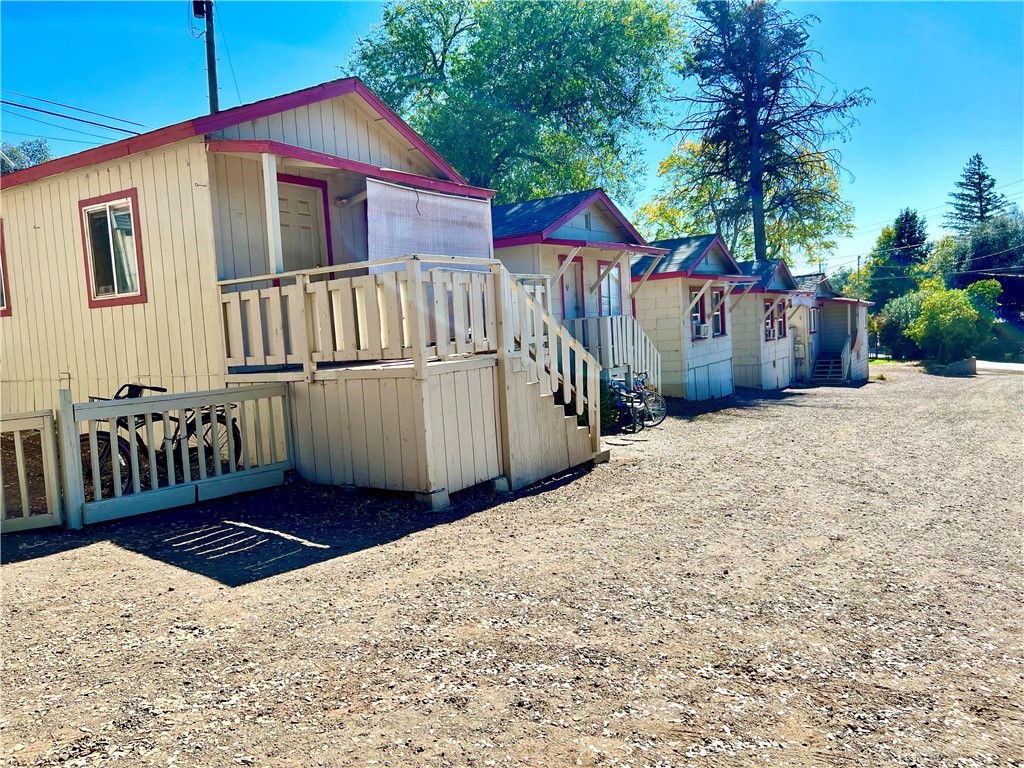 a view of a house with wooden fence