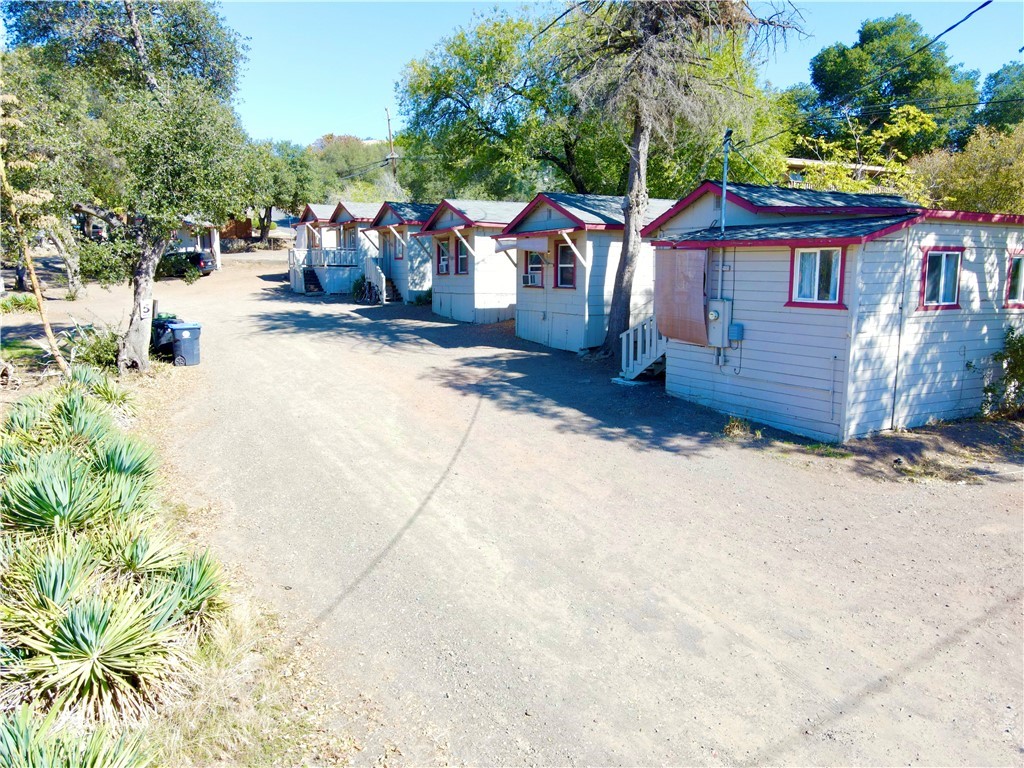 13992 Lakeshore Drive Clearlake, CA 95422 - Photo 2 of 35 a view of a house with a yard and garage